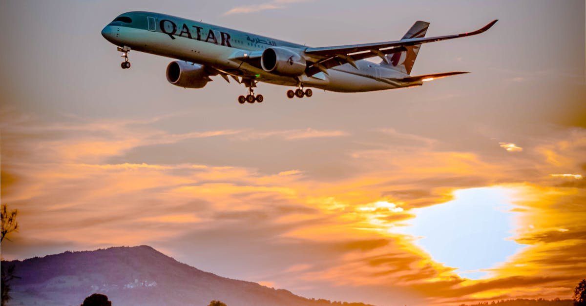 A passenger airplane flying over a scenic landscape at sunset, capturing the aviation spirit.